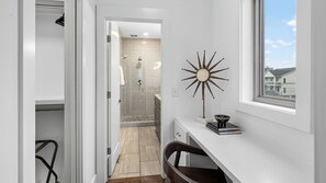 A modern bathroom with a shower, a vanity with a mirror, and a view of the outside. - The Mod Buchanan by Avantstay Hot Tub + Rooftop Putting Mat + Game Room (Nashville)