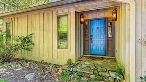 A house with a blue door, stone steps, and a small garden. - Mtn-View Cashiers Cottage w Screened Deck! (Glenville)