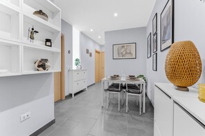 A modern interior with a dining area, white cabinetry, and artwork on the walls. - Scarlatti31 - Beautiful apartment in the heart of Milan, Milan Central Station (Milano)