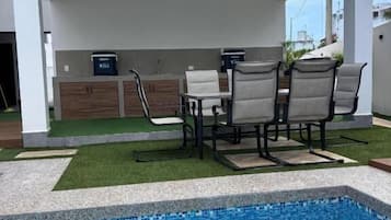Deluxe House, Balcony, Garden View | Living area | Smart TV