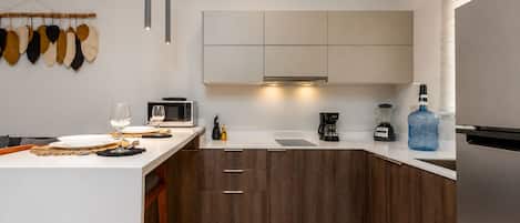 Deluxe Apartment, Patio, Courtyard View | Private kitchen | Full-size fridge, microwave, stovetop, cookware/dishes/utensils
