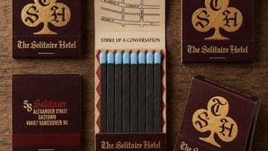 Matchboxes with hotel branding, a map, and a set of matches. - The Solitaire Hotel (Vancouver)
