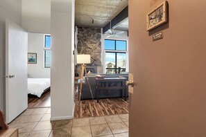 A room with a bed, a fireplace, a sofa, and a dining table. - Lovely Ski in Ski out condo with amenities!!! (Steamboat Springs)
