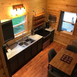 Coffee/tea maker, fridge, microwave, oven