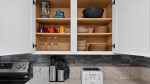 A kitchen with a built-in oven, a toaster, and a knife block. - Lander & Mt Rose Duo | Near Midtown & Downtown (Reno)