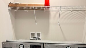 A laundry room with two front-loading LG ThinQ washers and dryers. - Beautiful Townhouse 4 bedroom 3  bathroom in Fogelsville PA (Fogelsville)