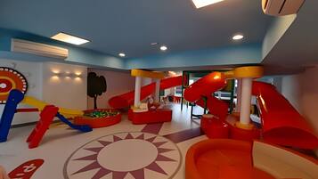 A children's play area with slides and a ball pit.