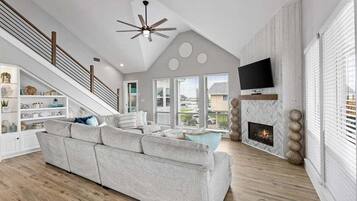 House, Multiple Beds, Pool Access, Pool View (Bay Dayz) | Living area | Fireplace