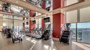 A gym with treadmills, weight machines, and a city view. - Entire apartment in Miami – NEW (Miami)