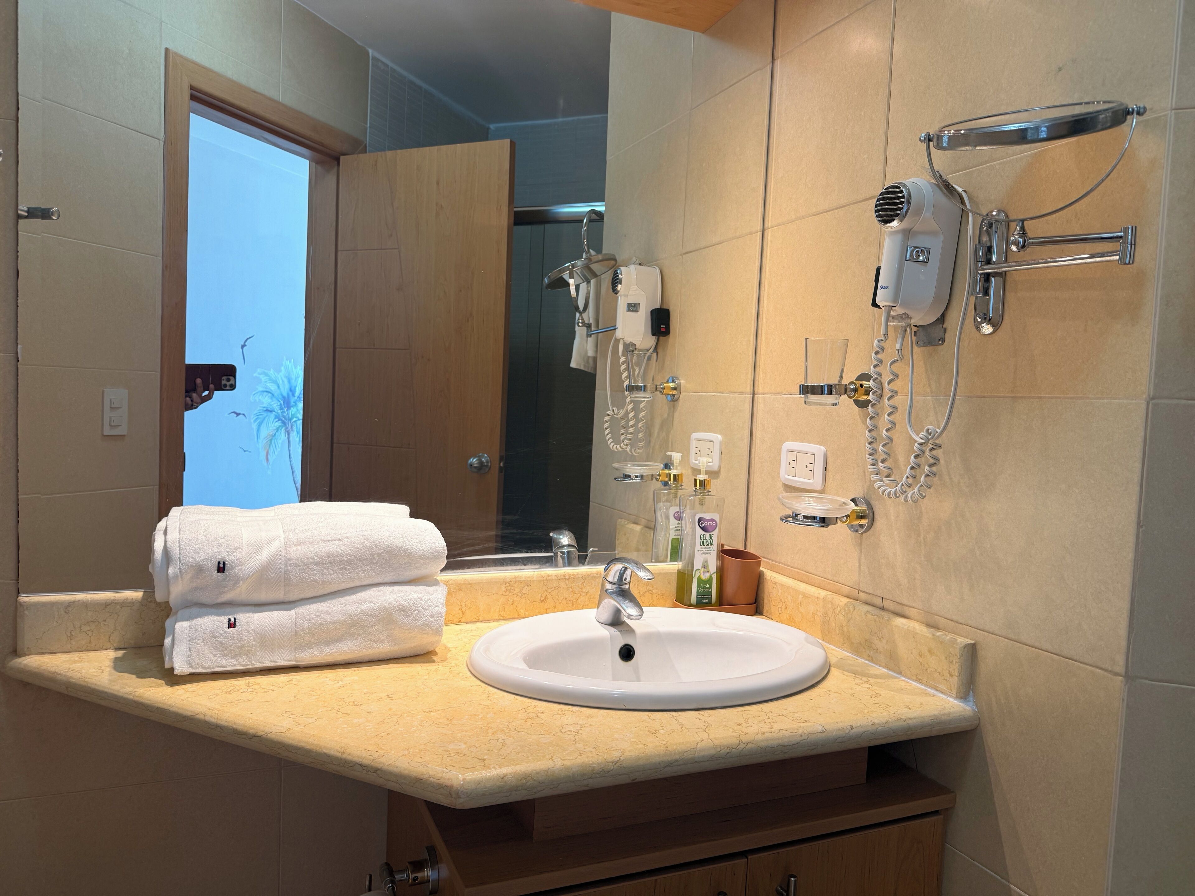 Shower, hair dryer, towels, toilet paper