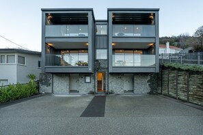 A modern two-story building with a central entrance, large windows, and a stone facade. - Queenstown Quarters - Residence I (Queenstown)