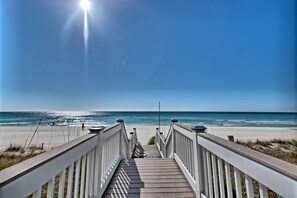 A wooden boardwalk leading to a beach with a clear sky. - Sterling Breeze PCB | 3BR Luxury near Pier Park (Panama City Beach)