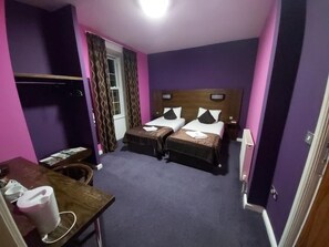 A hotel room with two beds, a desk, and a chair. - The Queensberry (Dumfries)