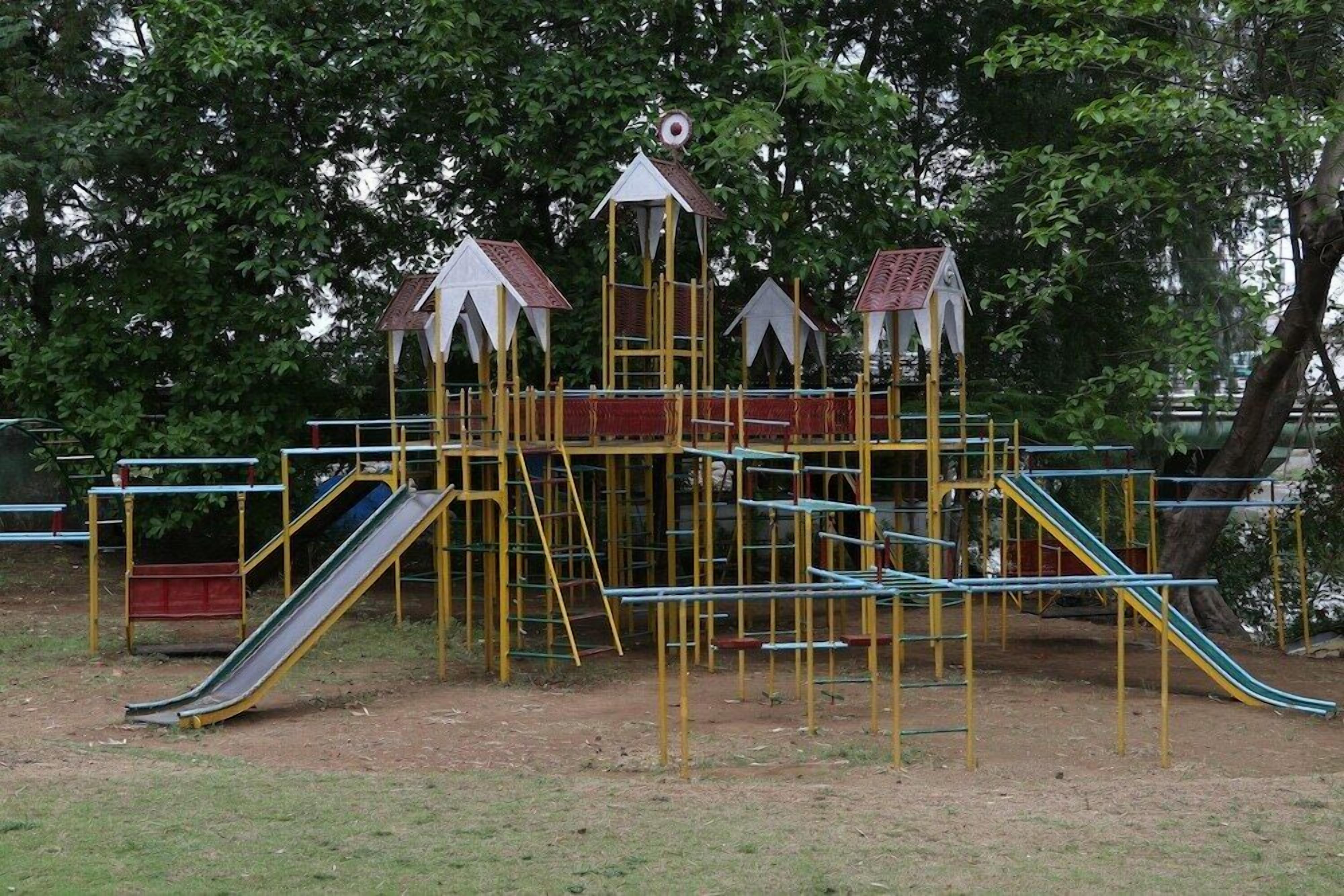 A playground with slides and climbing structures.