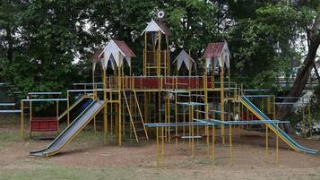 A playground with slides and climbing structures.