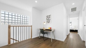 A room with a desk, chair, and a wall with alphabet letters. - Domi rentals - The Highland House (Oakleigh East)