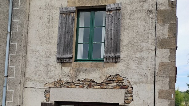 A two-story building with a stone facade, a wooden door, and two windows with shutters. - Number 33, Village house in Rancon, sleeps 4 (Rancon)