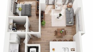 A modern apartment layout with a living room, dining area, kitchen, and a balcony. - One Bedroom King bedded room with direct views of Lake Superior (Duluth)