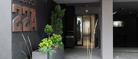 A modern building entrance with a large sign reading 'ZABLOCH 22A'.