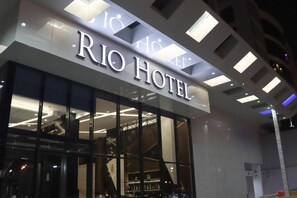 The exterior of the Rio Hotel with a modern facade and large glass windows. - Rio Hotel (Riyadh)