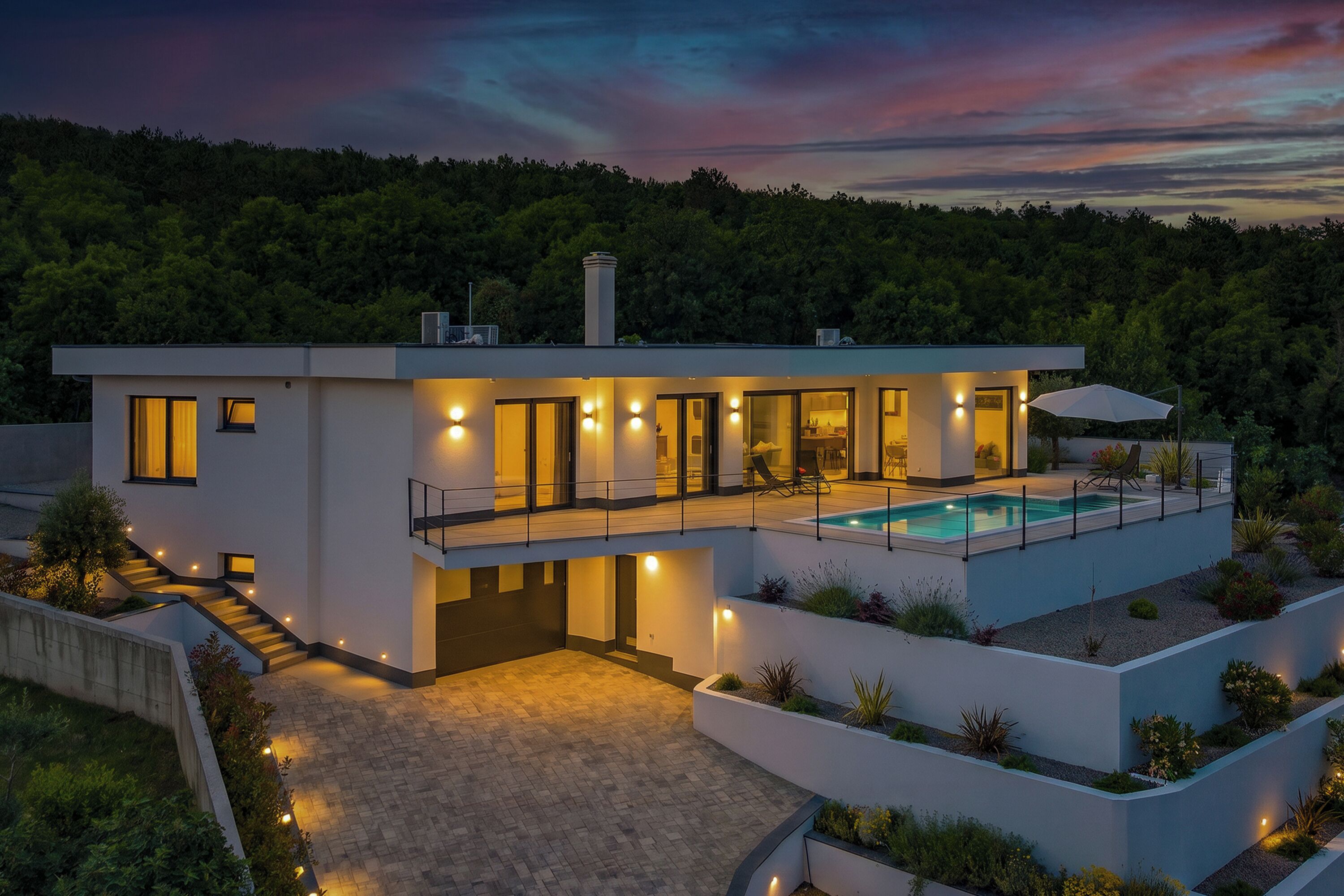 A modern two-story house with a swimming pool, a covered patio, and a landscaped garden.