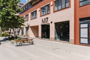 A building with a sign reading 'A17' and a bench in front. - A17 Suites (Plovdiv)