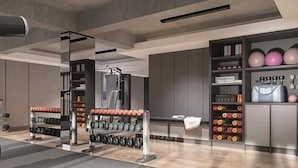A modern gym with weightlifting equipment, dumbbells, and exercise balls. - Laska Hotel and Resort Ciletuh (Girimukti)