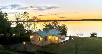 Exclusive beach cottage with a private beach, dock, and garden