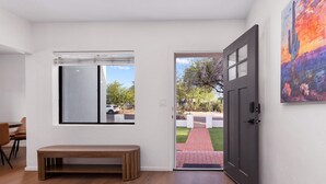 A room with a bench, a door, and a window. - Luxury 5 BR Retreat. Sleeps 10+. Near U of A. (Tucson)