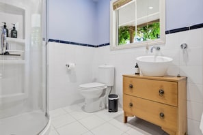 Shower, hair dryer, towels, soap
