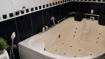 Shower, towels, soap, toilet paper