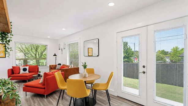 A modern living room with a sofa, chairs, and a dining table. - Cozy East Austin 3BR for 6, Near DT & Rodeo Austin! (Austin)