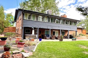A modern two-story house with a covered patio area. - Welcome to Your Family's Ultimate Colorado Basecamp! (Arvada)
