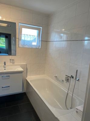 Shower, hair dryer, towels