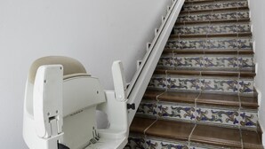 A staircase with ornate tile patterns and a white handrail. - Sunstay Pedregal C Flat I Málaga (Málaga)