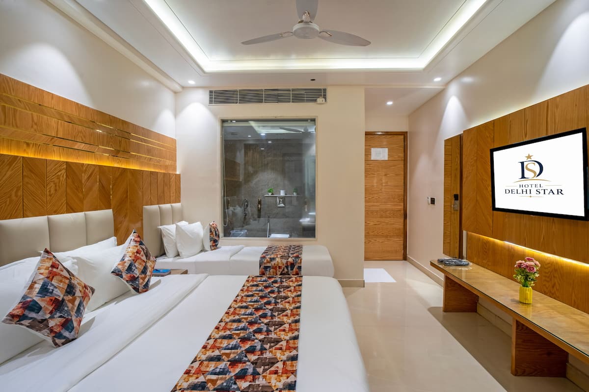 Premium Triple Room | Desk, bed sheets