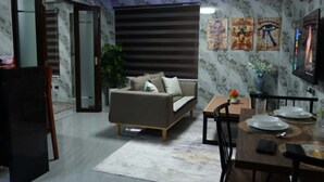 Living area - Modern Condotel Near Clark Airport -5 mins to SM Clark and Walking street (Angeles)