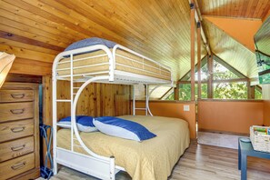 A bunk bed with a ladder, wooden walls, a dresser, and a window with a view. - 6 Mi to Eureka Springs! Home By Table Rock Lake (Holiday Island)