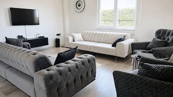 Estudio Deluxe | Área de sala de estar