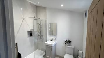 Shower, deep soaking tub, hair dryer, towels