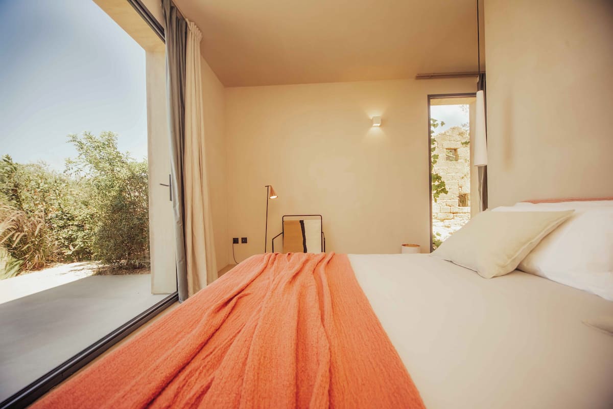Deluxe Double Room, Ocean View | In-room safe, blackout drapes, iron/ironing board (on request)