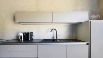 Coffee/tea maker, fridge, stovetop, dishwasher