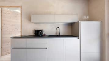 Coffee/tea maker, fridge, stovetop, dishwasher