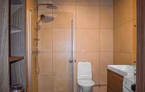 A bathroom with a shower, toilet, and sink. - Gorgeous home in Kivik with WiFi (Kivik)