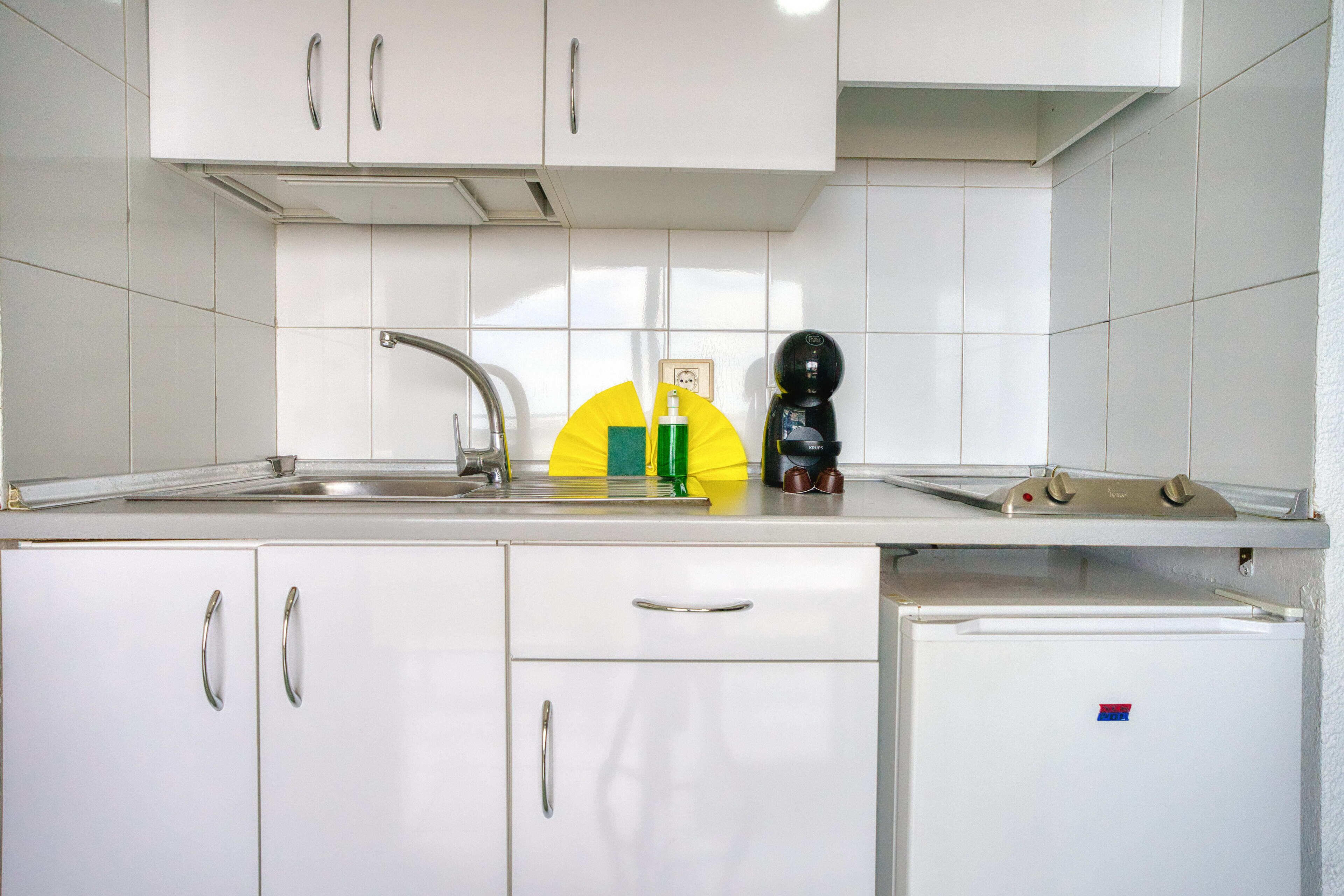Standard Apartment, Balcony, Partial Sea View | Private kitchen | Fridge, microwave, stovetop, cookware/dishes/utensils