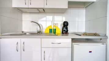 Standard Apartment, Balcony, Partial Sea View | Private kitchen | Fridge, microwave, stovetop, cookware/dishes/utensils