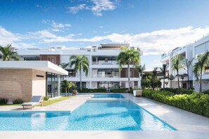 Jump in for a swim, then kick back on a lounger and soak up the sun. Wander around, find your spot, and just enjoy the day your way. - Beachfront 2BR Condo w/ Balcony • Sol de Arena E4 (Las Terrenas)