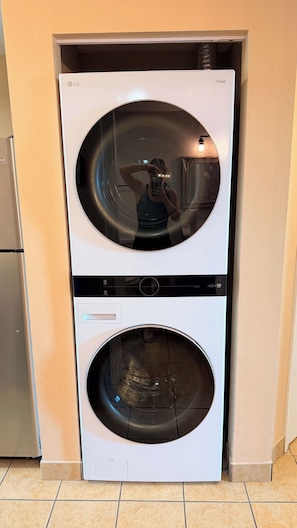 A front-loading LG Thinq washer and dryer unit in a kitchen. - Harbourgate Resort and Marina 504 (North Myrtle Beach)