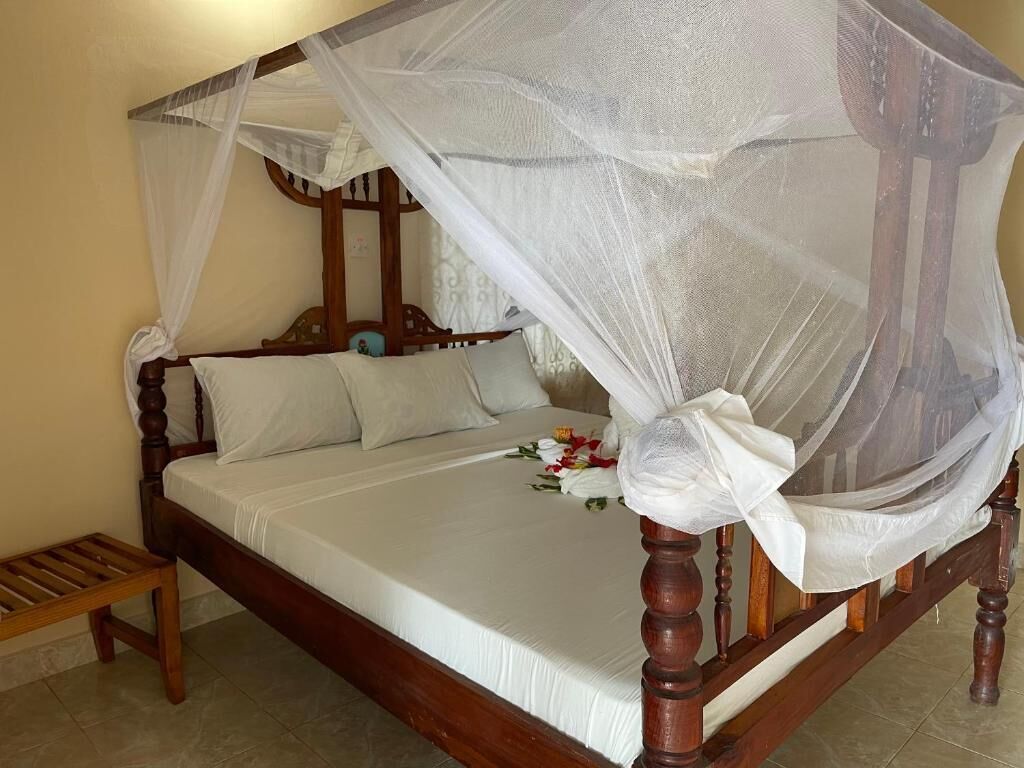 Bungalow, Garden View | In-room safe, blackout drapes, iron/ironing board (on request)