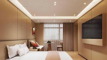 A modern bedroom with a bed, bedside table, chair, TV, and a window with curtains.